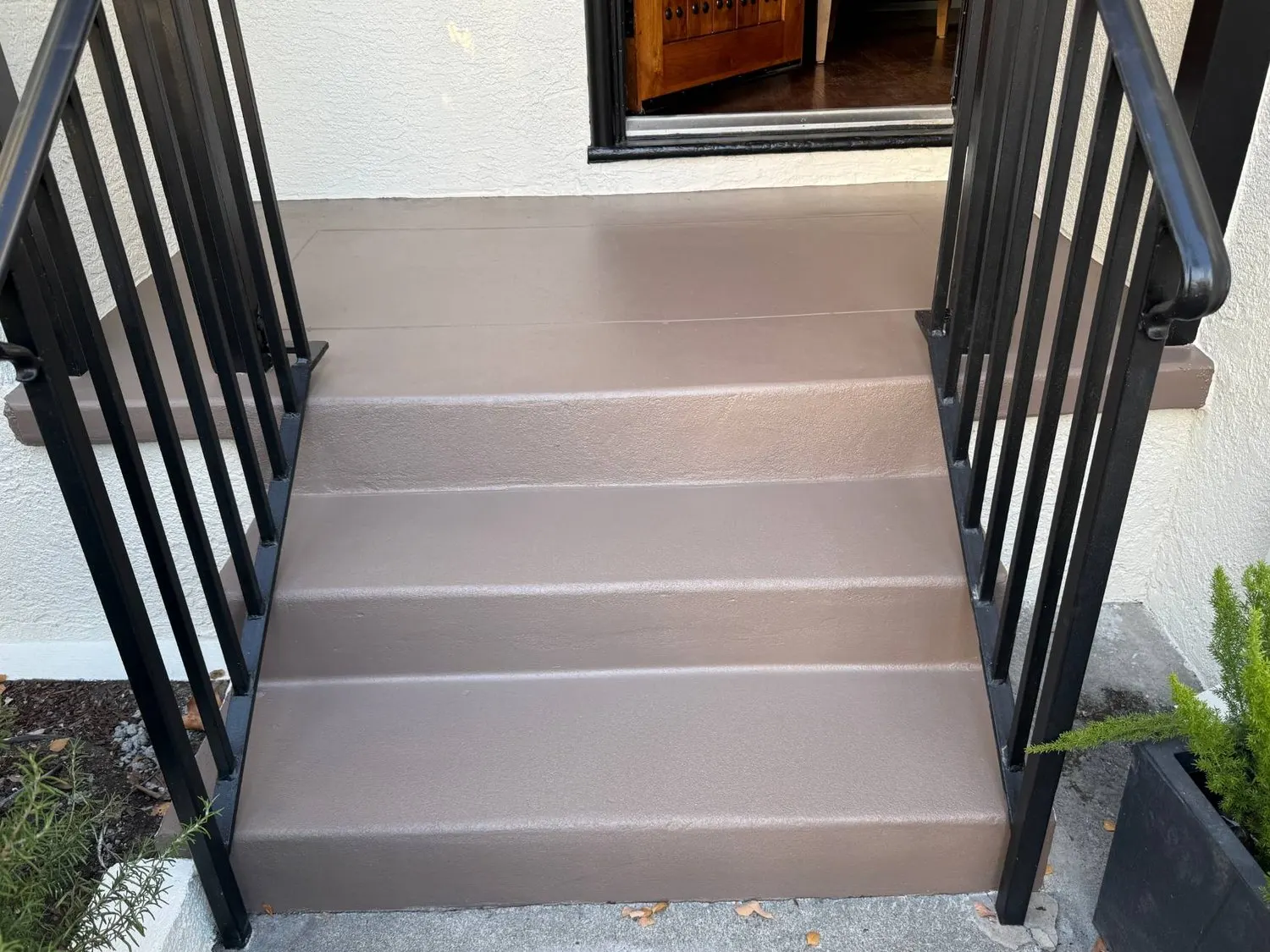 Same steps repaired and coated in brown